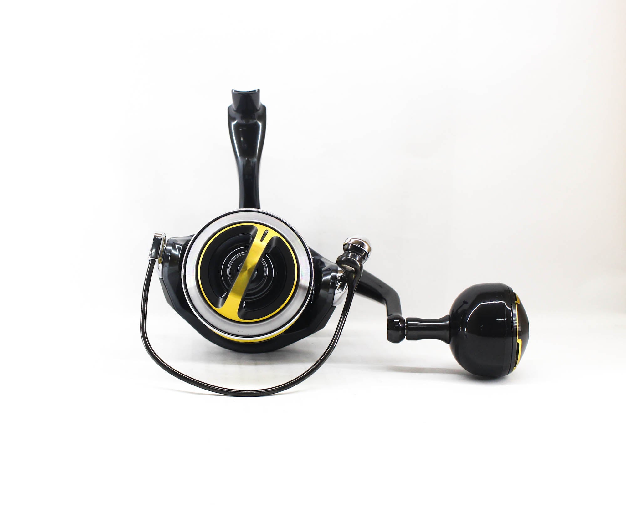 Fishing reel with black and yellow design on a white background