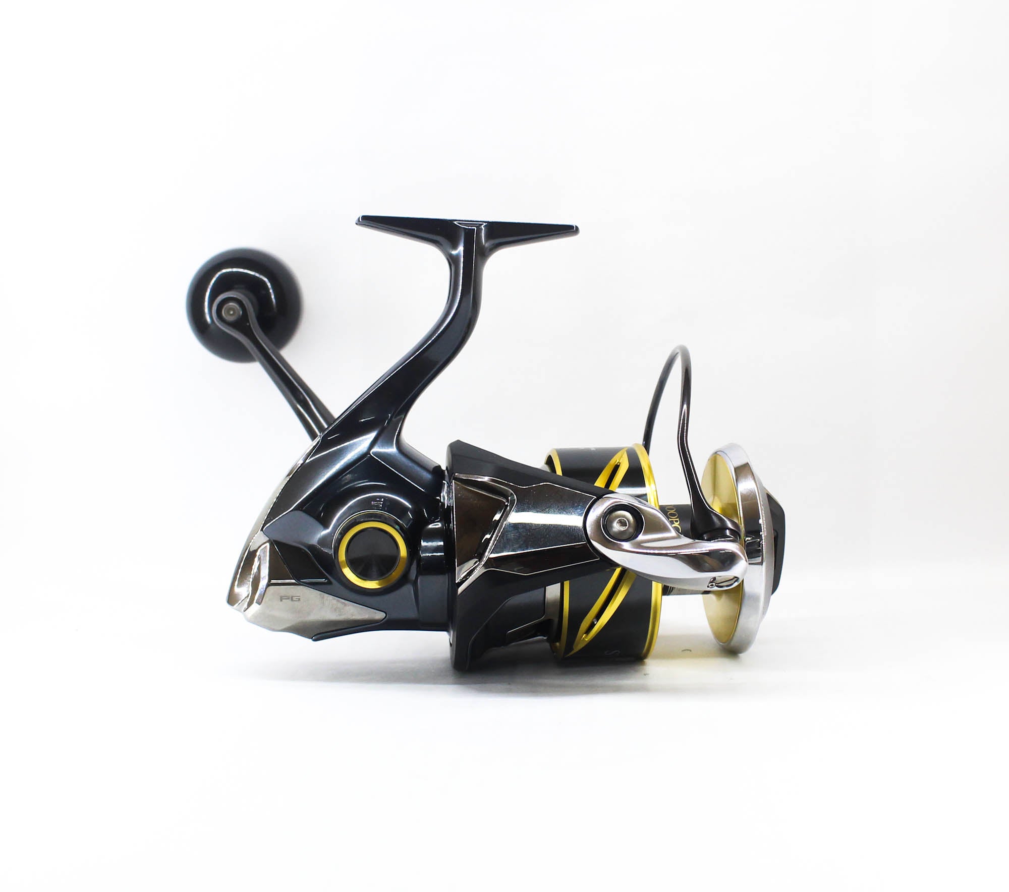 Two fishing reels on a white background