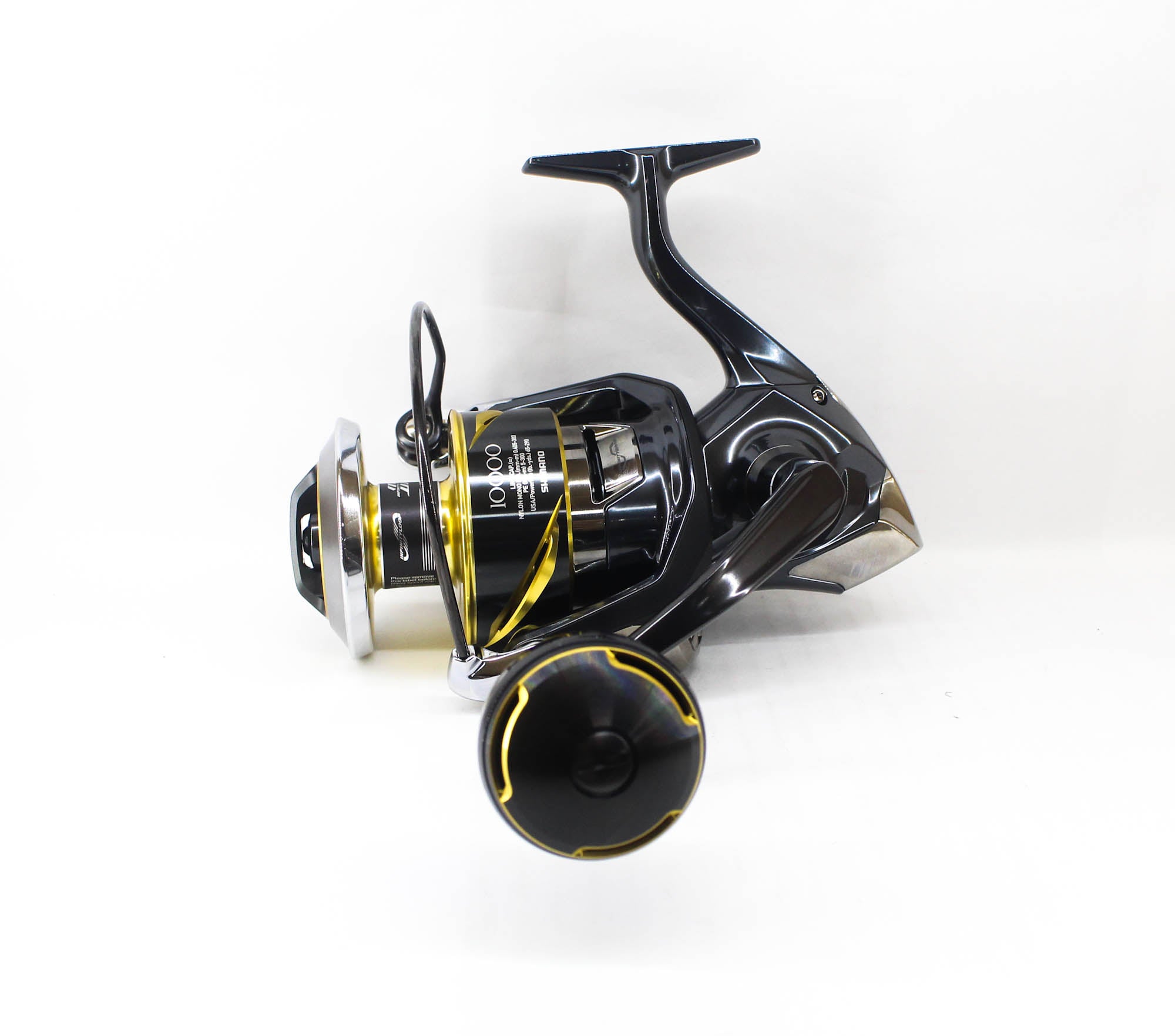 Fishing reel with black and yellow design on a white background
