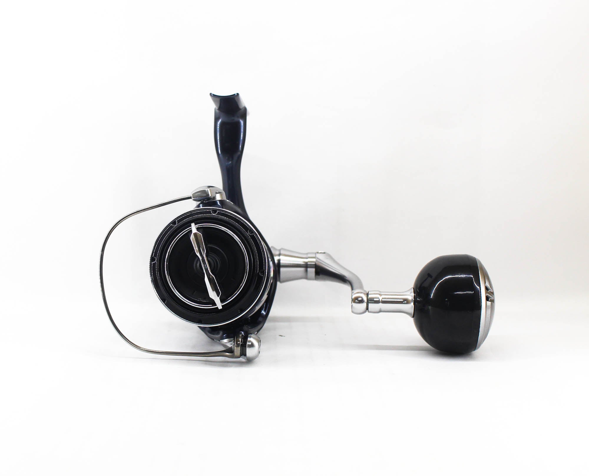 Fishing reel with black and silver design on a white background